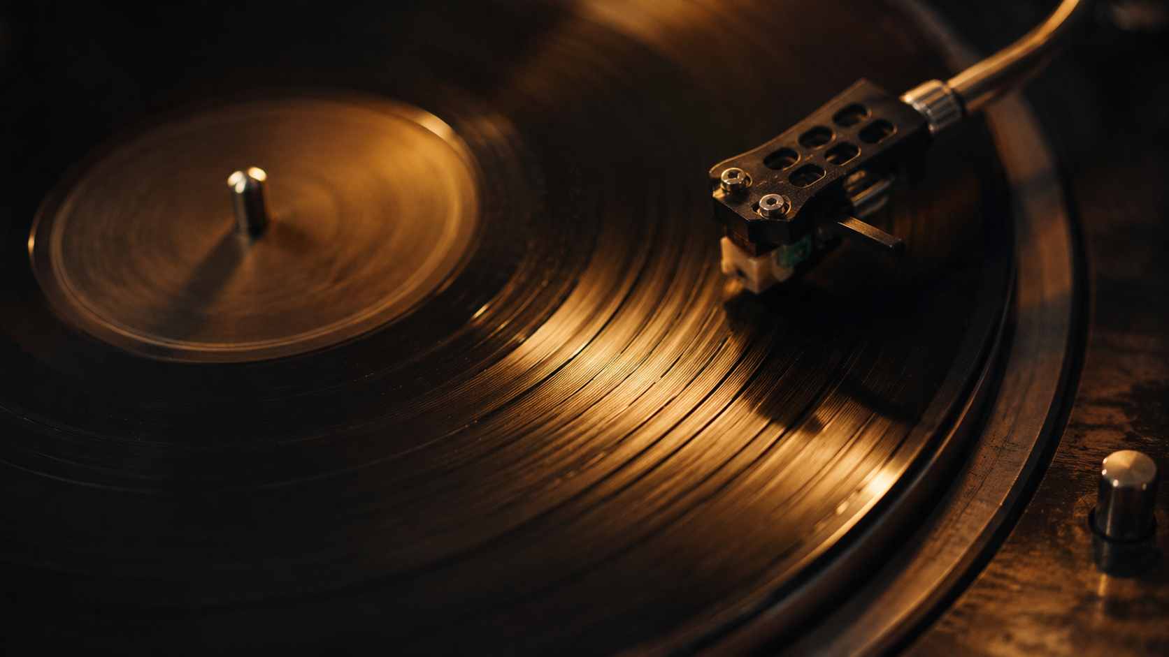 A vinyl record spinning on a turntable — warm, analog, alive with imperfection